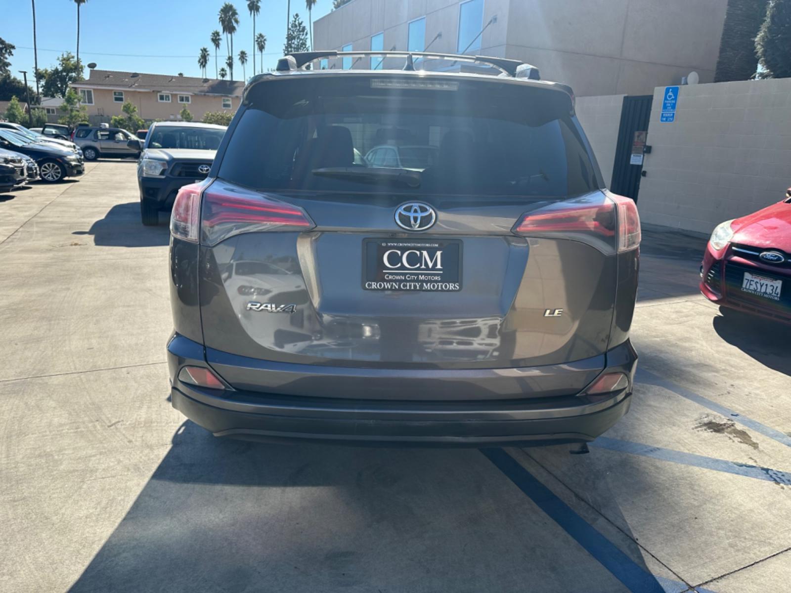 2016 Gray /Black Toyota RAV4 (JTMZFREVXGJ) , AUTOMATIC transmission, located at 30 S. Berkeley Avenue, Pasadena, CA, 91107, (626) 248-7567, 34.145447, -118.109398 - Crown City Motors is a used “Buy Here Pay Here” car dealer in Pasadena CA. “Buy Here Pay Here” financing, means that when you purchase your vehicle from our dealership, that you make the payments to the dealership as well. We do not need the banks approval to get you approved for a used auto - Photo #3